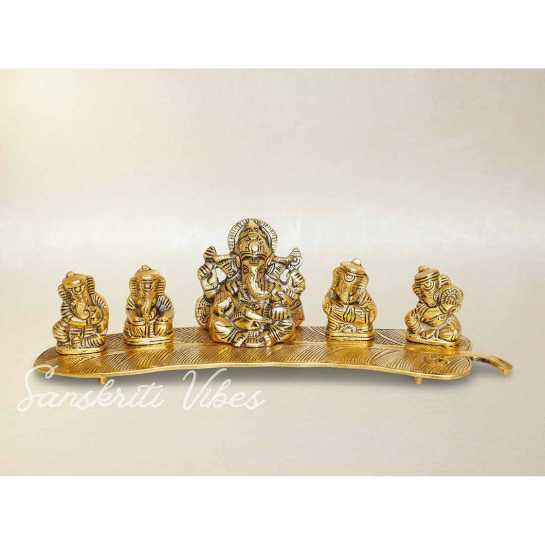 White Metal Gold Plated Ganesha On Leaf With Musical Instrument Metal Statue For Pooja Home Decor And Gift Purpose