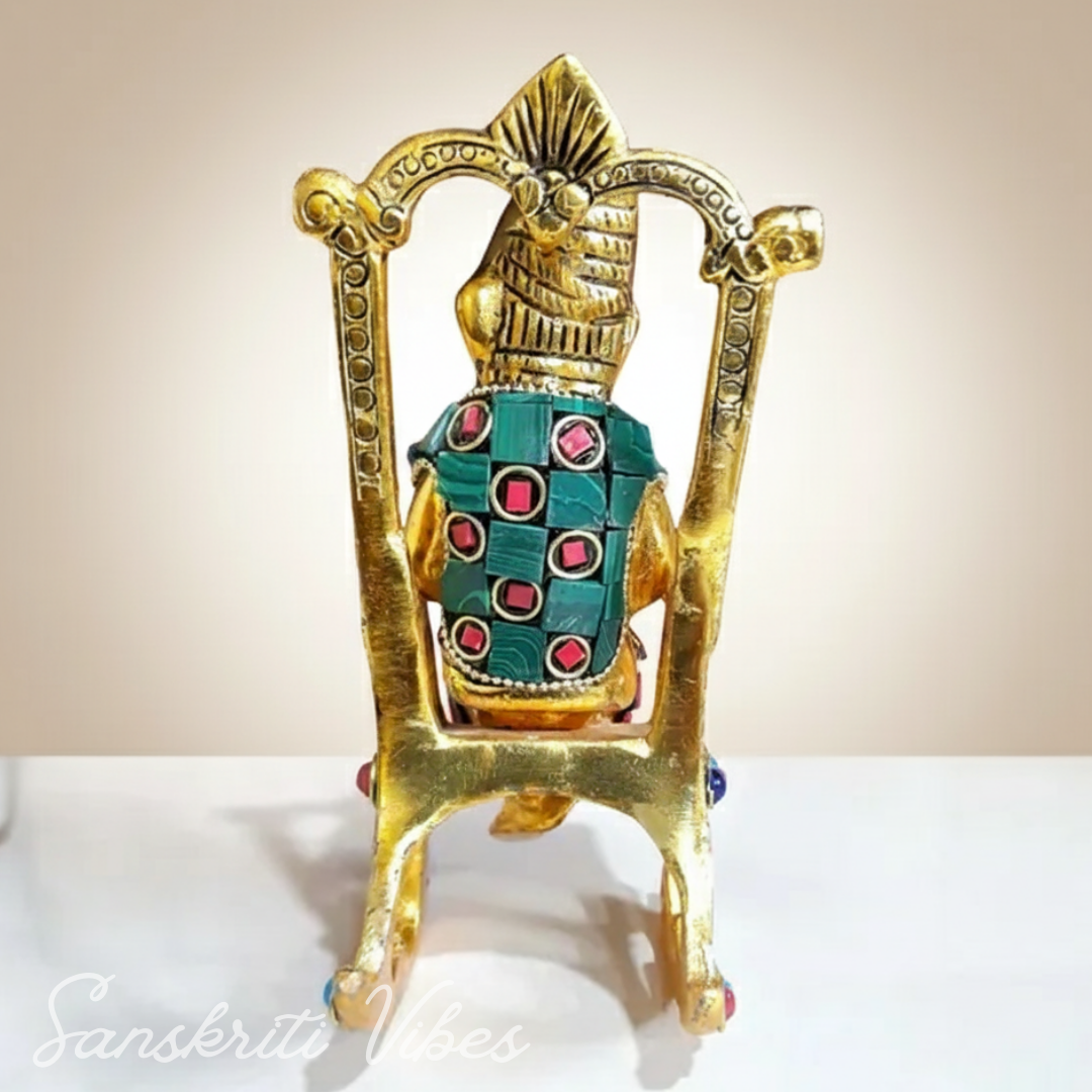 Modern Chair Ganesha Metal Statue Reading Ramayan with Stone Work Showpiece for Home Glossy Finish Ganpati Idol