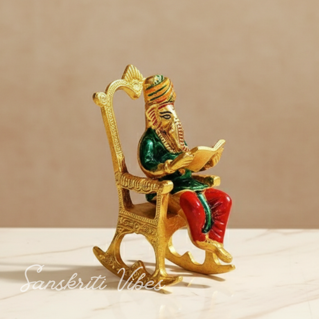 Modern Chair Ganesha Metal Statue Reading Ramayan with Meenakari Work Aluminium Ganesh Showpiece for Home Decor and Auspicious Gifting