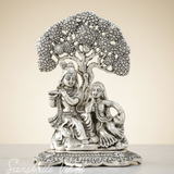 Metal Radha Krishna Idol Under Tree | Silver Decorative Showpiece Statue for Puja Room, Home & Office Desk – 18 cm Spiritual Gift