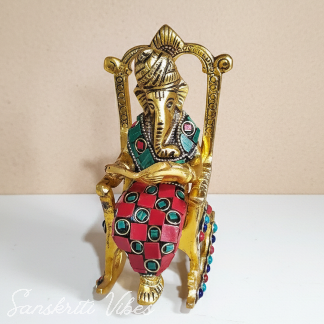 Modern Chair Ganesha Metal Statue Reading Ramayan with Stone Work Showpiece for Home Glossy Finish Ganpati Idol