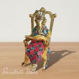 Modern Chair Ganesha Metal Statue Reading Ramayan with Stone Work Showpiece for Home Glossy Finish Ganpati Idol