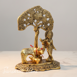 Kamdhenu Cow with Krishna Standing Under Tree Playing Flute – Metal Decorative Statue by Sanskriti Vibes | Glossy Finish for Home Temple & Pooja